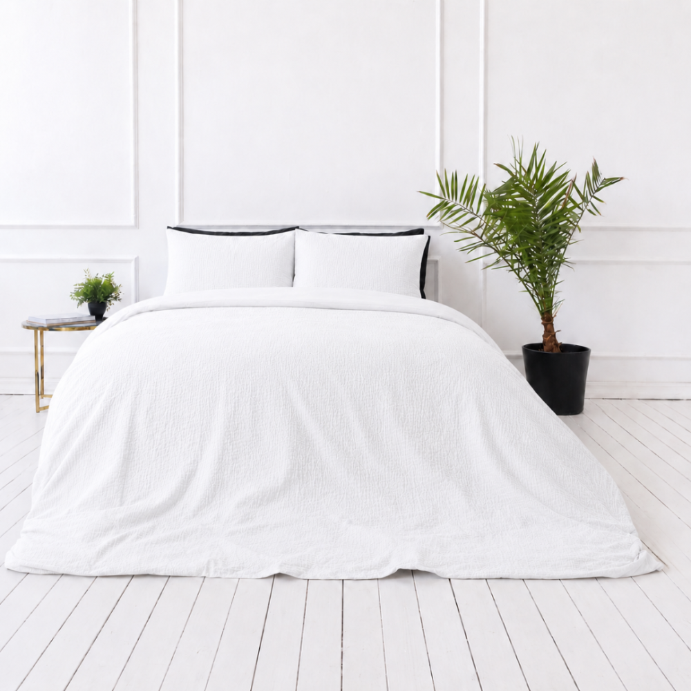 Påslakanset muslin „White muslin“. Påslakanset, 200x200 cm, 200x220 cm. Minimalistiskt vitt bäddset med lätt muslinstruktur